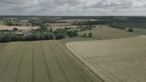 Drone Ascending Over Wheat Fields Under Cloudy Sky, Ille-et-Vilaine, France Stock Footage 302565917