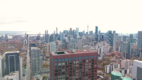 Drone ascending panoramic view of downtown Toronto skyline with sunlight and Stock Footage 330037752