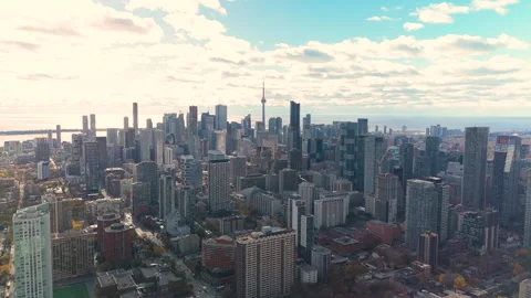 Drone ascending panoramic view of downtown Toronto skyline with sunlight and Stock Footage 330039085