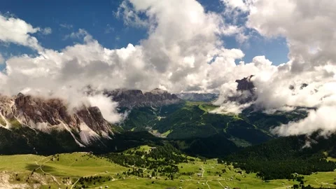 Drone Ascending with View Over Green Meadows and Mountains in the Dolomites Stock Footage 313892068