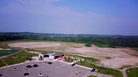 Drone Ascends Above a Vast Circular Development Site Stock Footage 347151018
