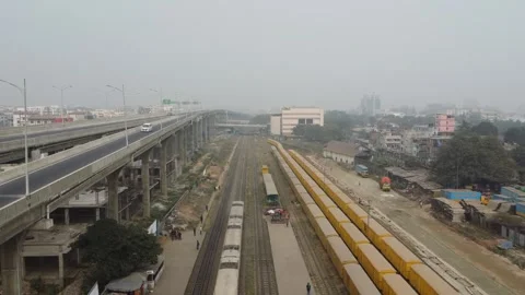 Drone Ascends from High Angle Showing Elevated Highway and Train Area in Dhaka Video stock 327372892