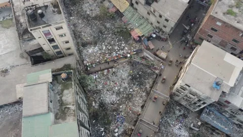 Drone Ascends Higher Revealing Dense Urban Area and Street Life in Dhaka Stock Footage 327326687