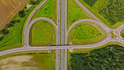 Drone Ascends Over Highway Junction And Curved Roads Near Paslek In North Poland Vidéo 348155376