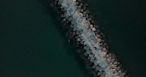 The drone ascends over rocks in the ocean Video stock 270340958