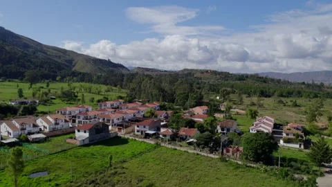 As the drone ascends, a patchwork of terracotta rooftops and colonial-era Video stock 265888153