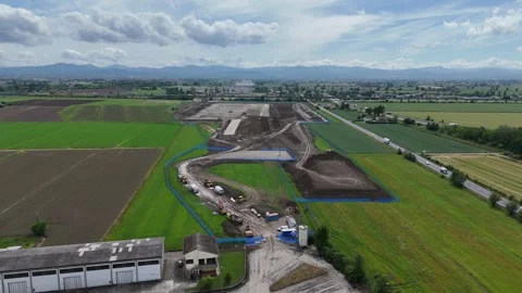 Drone ascent above data center construction site in the Po Valley near SS9 Via Stock Footage 340604201