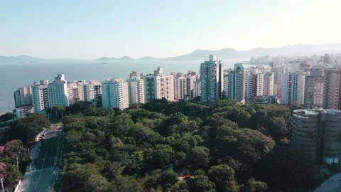 Drone ascent and forward motion over downtown Florianópolis buildings, Vidéo 250236570