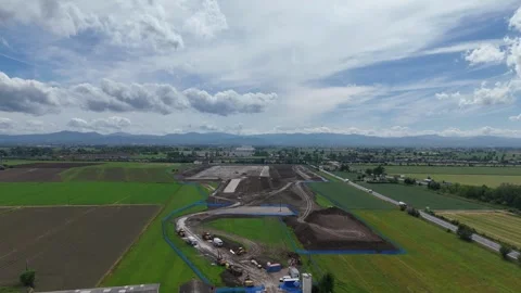 Drone ascent with parallax above logistics development in the Po Valley Italy Stock Footage 336257141
