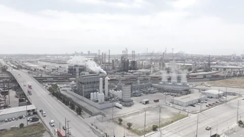 Drone asending on the corner shot facing long beach of the refinery Stock Footage 290816516