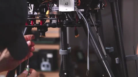 Drone Assembling Quad Copter Preparation for Flight Stock Footage 142137199