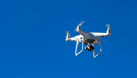 Drone on a background of blue sky Stock Photos