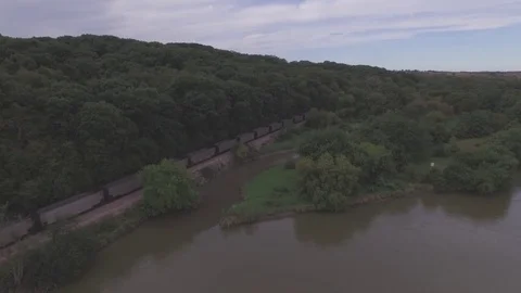 Drone Backing Away And Ascending From Train Over River Raw Stock Footage 78888438