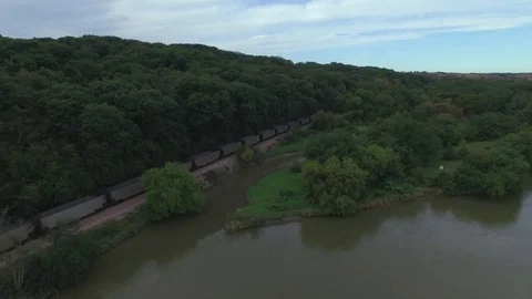Drone Backing Away And Ascending From Train Over River Stock Footage 78888439