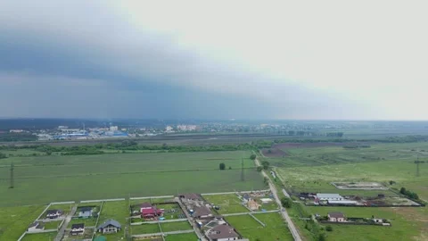 Drone Backward Flight Over Cozy Village and Fairy-Tale Sky Stock Footage 310531302