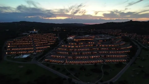 Drone Backward Flight at Sunset Revealing Coastal Hotel and Sea in Sardi Vídeo Stock 334564440