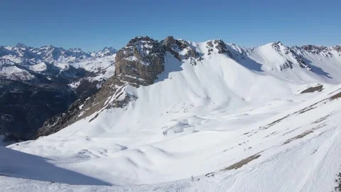 Drone backward flight on the top of the snow-covered mountain during winter, 4k Stock Footage 171948112
