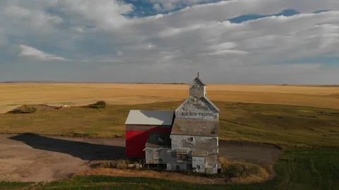 Drone backward shot of an old weathered grain elevator for storing wheat Stock Footage 170369760