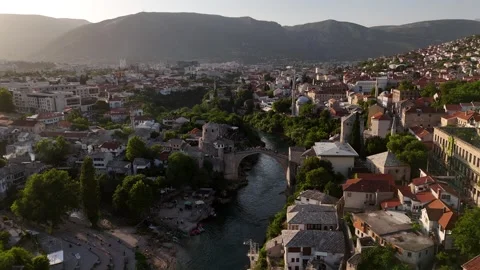 Drone Backward Tracking Shot Revealing Mostar City Valley and Bridge 4K Vídeo Stock 337831046