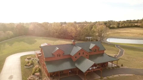 Drone of Barn with Sun Flares at Sunset / Wedding Reception Stock Footage 120476002