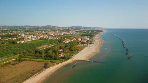 Drone beach coast town sea aerial backward flying reveal shot 库存影片 345215596