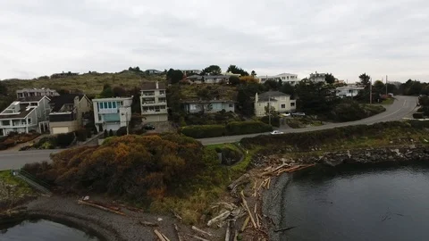 Drone of beach front to house on shore Stock Footage 127002133