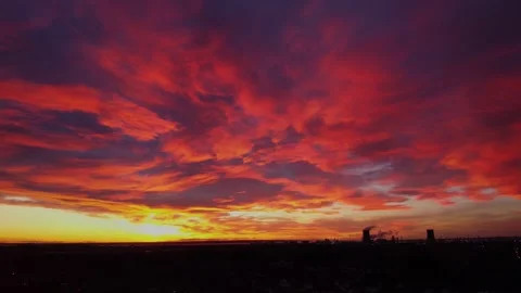 Drone. Beautiful red sky winter sunset in a UK village. Stock Footage 296636630