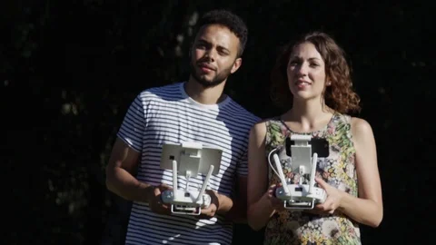 Drone Being Flown By Attractive Mixed Ethnicity Hip Tech Entrepreneurs Outside Stock Footage 82591075
