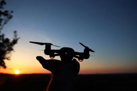 Drone being launched at sunset Stock Photos