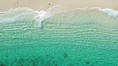 Drone Bird’s Eye View 4K: Pristine Turquoise Water and Waves Lapping on White Sa Stock Footage 343477034