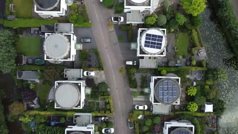 Drone birds eye view of modern semi-detached houses w/ solar panels, smart homes Stock Footage