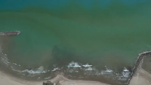 Drone Birdseye view booming down onto beach 스톡 동영상 150802907