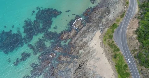 Drone birdseye view of great ocean road with car Stock Footage 84267441