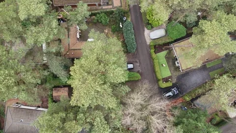 Drone birdview, above small cottages in Beekbergen the Netherlands Stock Footage 302918005