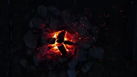 Drone blasting off a camp fire to space Stock Footage 247643808