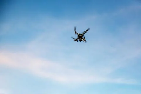 Drone in the blue sky. Stock Photos