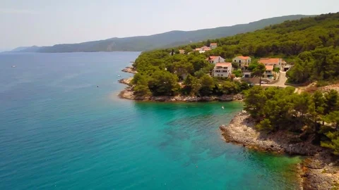 DRONE BRAC TRACK AND PAN RIGHT REVEALING SMALL BAY 4K CINEMATIC Stock Footage 113417269