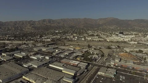 Drone Burbank CA slowly moving up then forward over industrial looking north Video stock 96271428