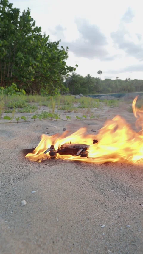 Drone burning on fire. Quadcopter blazing in flame. Stock Footage 277515914