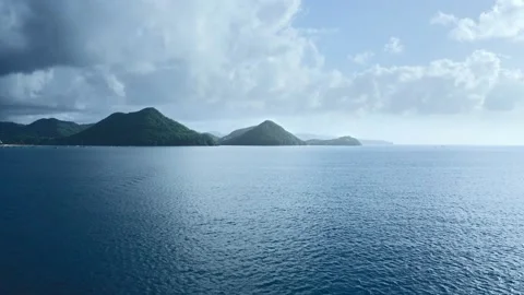 Drone camera approaches the mountains on the shore (Saint Lucia) Video stock 131992052