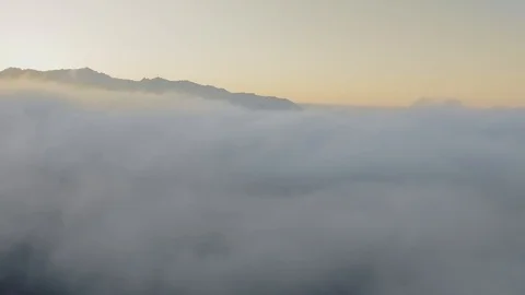 Drone camera breaks through the thick dawn clouds (Malibu Canyon, Calabasas Stock Footage 126678634