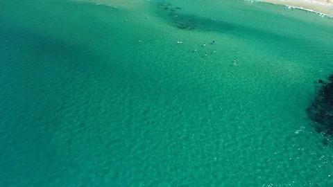 Drone camera chases clear wave from above Stock Footage 107075509