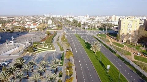 The drone camera descends in the direction of two cyclists riding a bike path Stock Footage 125210481