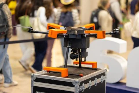 Drone with camera displayed at technology exhibition event Stock Photos