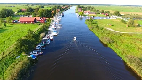 Drone camera flaying over the river on a countryside on a sunny summer day - 12 Stock Footage 74866708