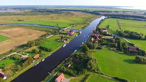 Drone camera flaying over the river on a countryside on a sunny summer day - 10 Stock Footage 74866961