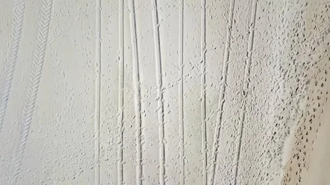 Drone camera flies along beach in Ocean City, Maryland with cam straight down Stock Footage 89452020