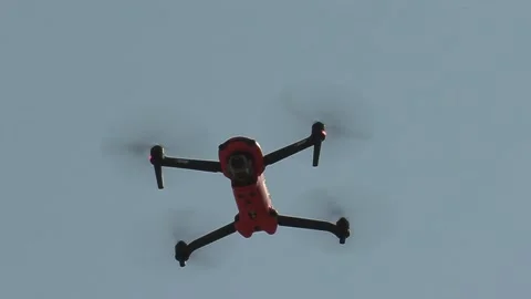 Drone with camera flying and filming over city streets Видео 152962339