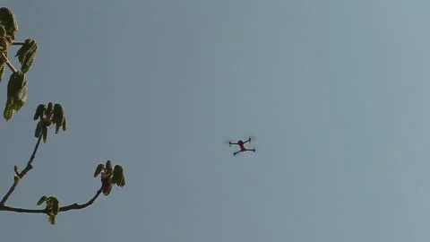 Drone with camera flying and filming over city streets 库存影片 152962419
