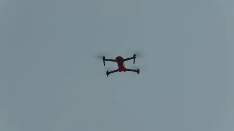 Drone with camera flying and filming over city streets 库存影片 152962472